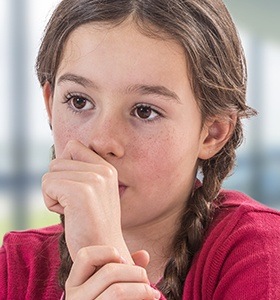 Young girl sucking her thumb