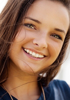 Teen girl with ceramic braces