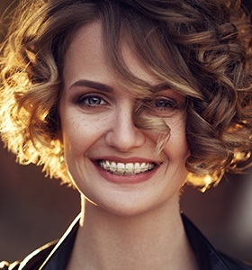 Smilign woman with clear braces