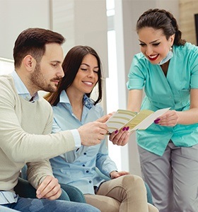 Man and woman talking to team member