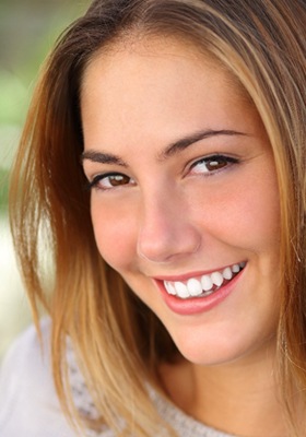 woman smiling outside