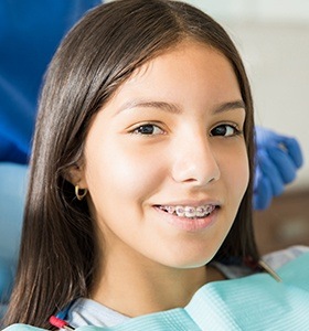 Teen with braces in orthodontic chair