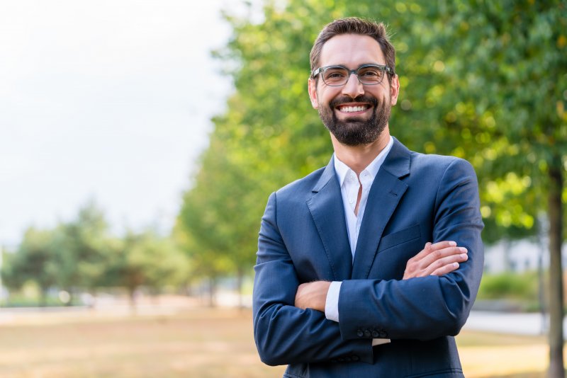 Man in suit smiling with straight teeth