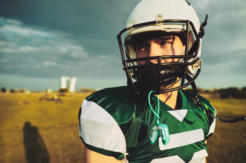 a teenager playing sports in Jacksonville during orthodontic treatment