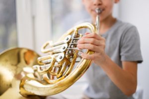 a teenager playing a musical instrument