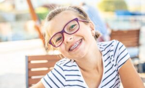 Child showing off braces. 